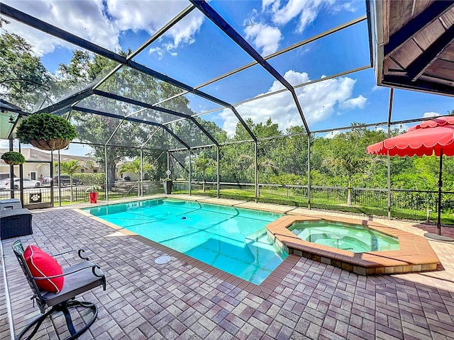 3008 Sutton Woods Dr, Plant City, FL 33566 - view of swimming pool featuring glass enclosure, a patio, and a pool with connected hot tub
