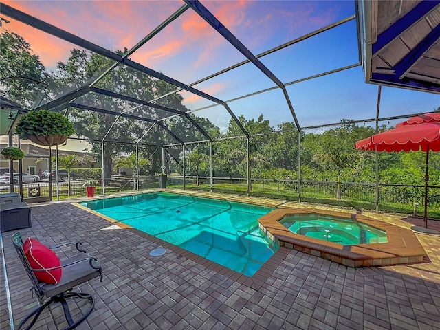 3008 Sutton Woods Dr, Plant City, FL 33566 - view of swimming pool with a lanai, a patio area, and a pool with connected hot tub
