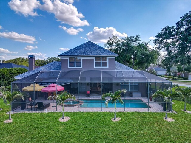 3008 Sutton Woods Dr, Plant City, FL 33566 - back of house with a pool with connected hot tub, a patio area, glass enclosure, a yard, and stucco siding