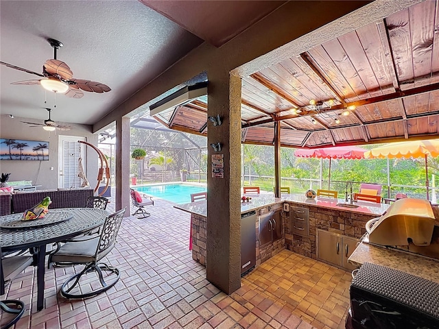 3008 Sutton Woods Dr, Plant City, FL 33566 - view of patio / terrace featuring a sink, an outdoor pool, a ceiling fan, exterior kitchen, and glass enclosure