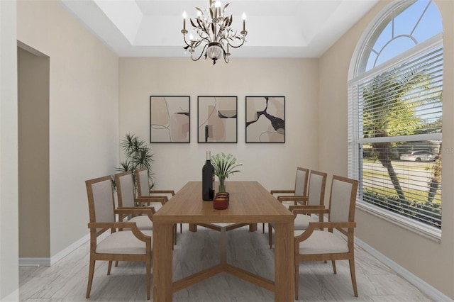 9885 Montclair Cir, Apopka, FL 32703 - dining space featuring plenty of natural light, baseboards, a tray ceiling, and a chandelier