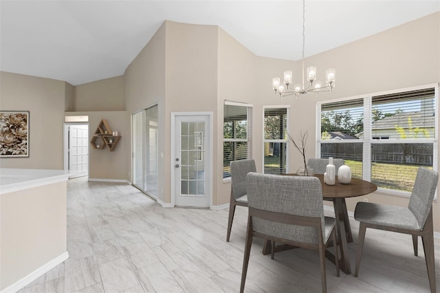 9885 Montclair Cir, Apopka, FL 32703 - dining space with high vaulted ceiling, a notable chandelier, baseboards, and marble finish floor