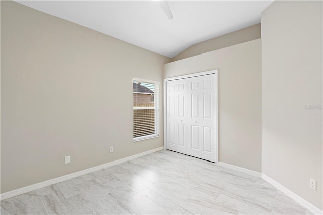 9885 Montclair Cir, Apopka, FL 32703 - unfurnished bedroom featuring baseboards, a ceiling fan, a closet, and lofted ceiling