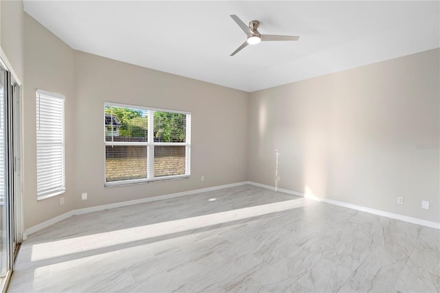 9885 Montclair Cir, Apopka, FL 32703 - unfurnished room featuring baseboards, marble finish floor, and ceiling fan