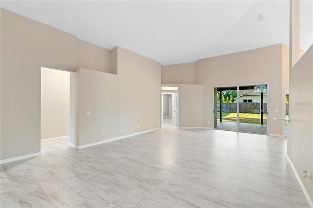 9885 Montclair Cir, Apopka, FL 32703 - empty room with high vaulted ceiling and baseboards