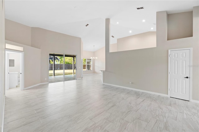 9885 Montclair Cir, Apopka, FL 32703 - unfurnished living room featuring an inviting chandelier, high vaulted ceiling, recessed lighting, baseboards, and visible vents