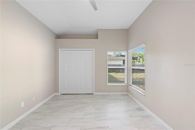 9885 Montclair Cir, Apopka, FL 32703 - unfurnished bedroom with baseboards, ceiling fan, a closet, and marble finish floor