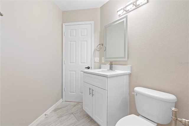 9885 Montclair Cir, Apopka, FL 32703 - bathroom with vanity, baseboards, toilet, and marble finish floor