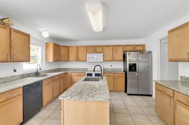 2658 Palmetto Ridge Cir, Apopka, FL 32712 - kitchen with white appliances, a sink, an island with sink, light stone countertops, and light tile patterned floors