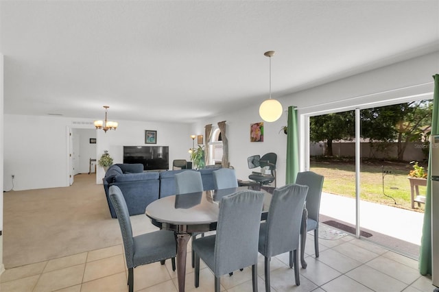 2658 Palmetto Ridge Cir, Apopka, FL 32712 - dining area with a chandelier, light tile patterned flooring, and light carpet