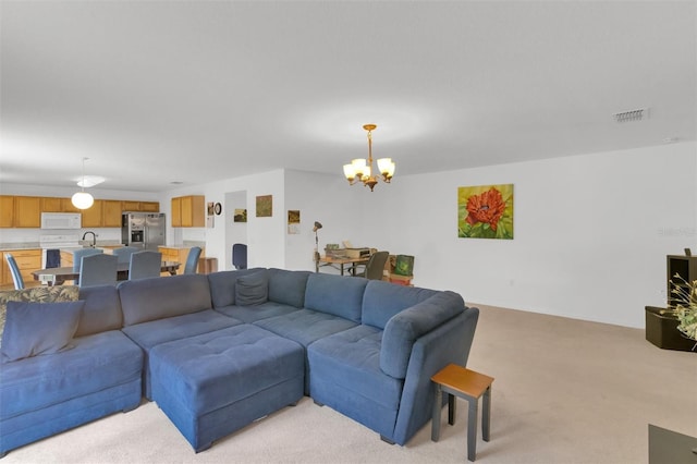 2658 Palmetto Ridge Cir, Apopka, FL 32712 - living room featuring a chandelier and light colored carpet
