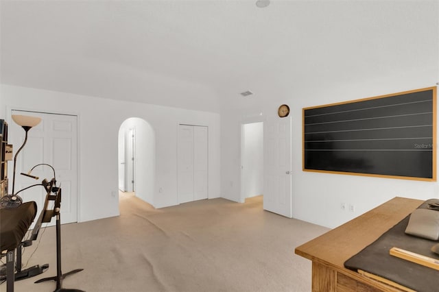 2658 Palmetto Ridge Cir, Apopka, FL 32712 - living room with carpet flooring and arched walkways