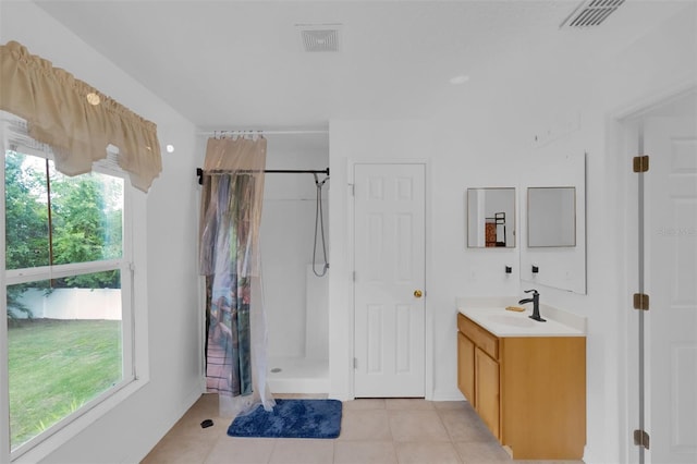 2658 Palmetto Ridge Cir, Apopka, FL 32712 - full bathroom with tile patterned floors, a stall shower, and vanity