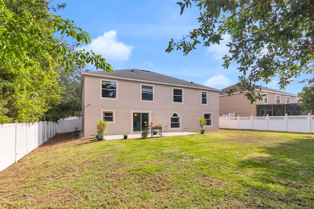 2658 Palmetto Ridge Cir, Apopka, FL 32712 - rear view of house with stucco siding and a patio area