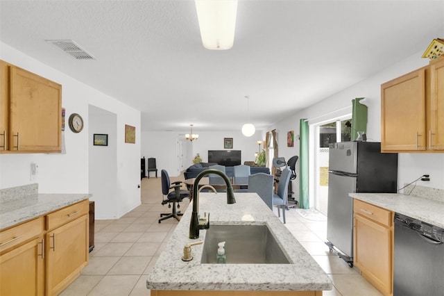 2658 Palmetto Ridge Cir, Apopka, FL 32712 - kitchen featuring black dishwasher, a sink, open floor plan, light tile patterned floors, and light stone counters