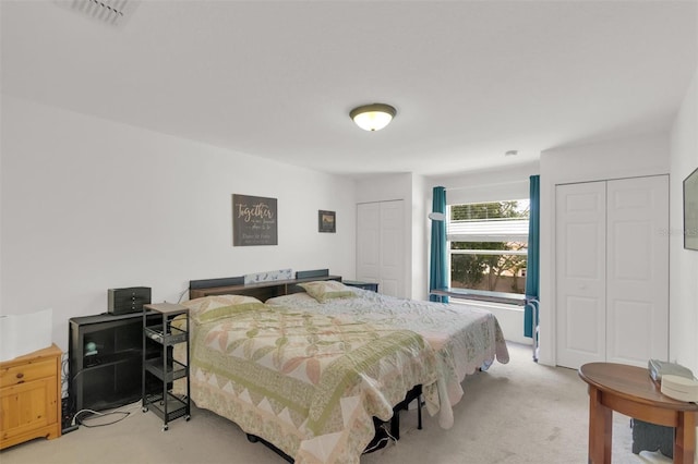 2658 Palmetto Ridge Cir, Apopka, FL 32712 - bedroom with light carpet and multiple closets