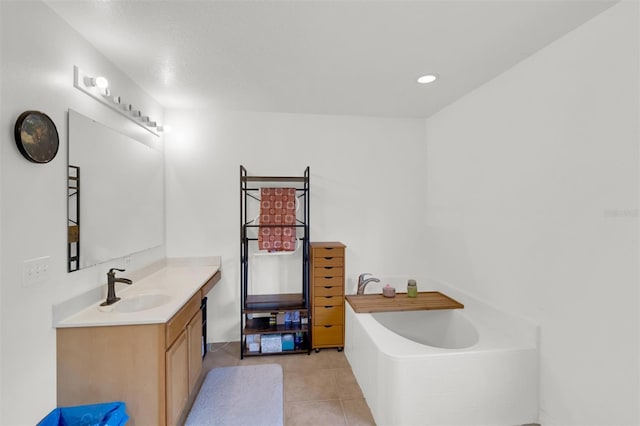 2658 Palmetto Ridge Cir, Apopka, FL 32712 - bathroom with vanity, a garden tub, tile patterned flooring, and recessed lighting