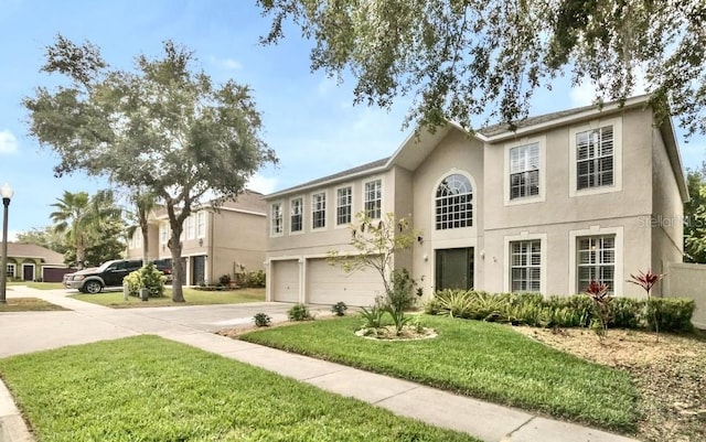 2658 Palmetto Ridge Cir, Apopka, FL 32712 - view of front of property with an attached garage, concrete driveway, stucco siding, and a front yard