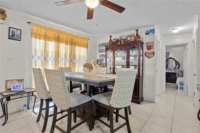 1828 Matterhorn Dr, Orlando, FL 32818 - dining room with a textured ceiling, ceiling fan, and light tile patterned floors
