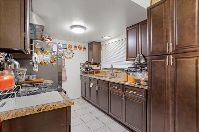1828 Matterhorn Dr, Orlando, FL 32818 - kitchen featuring dark brown cabinets, light tile patterned floors, and a sink
