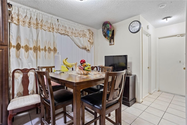 1828 Matterhorn Dr, Orlando, FL 32818 - dining area with a textured ceiling and light tile patterned floors