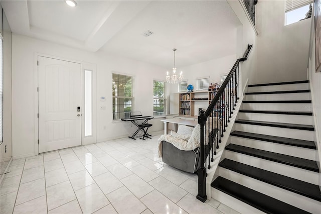 9567 Meadow Hunt Way, Winter Garden, FL 34787 - foyer entrance with stairway, baseboards, and an inviting chandelier