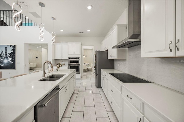9567 Meadow Hunt Way, Winter Garden, FL 34787 - kitchen with light countertops, a sink, wall chimney exhaust hood, and stainless steel appliances