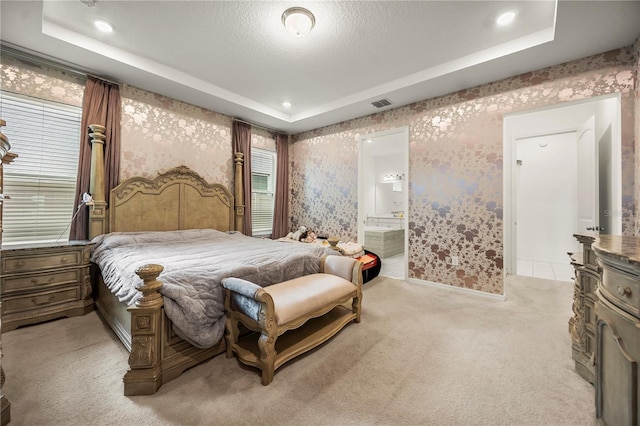 9567 Meadow Hunt Way, Winter Garden, FL 34787 - bedroom with light carpet, a tray ceiling, wallpapered walls, and visible vents