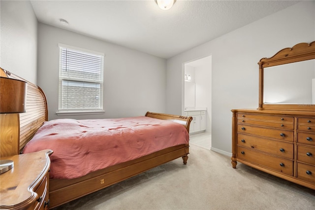 9567 Meadow Hunt Way, Winter Garden, FL 34787 - bedroom with connected bathroom, baseboards, and light colored carpet