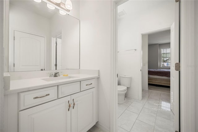 9567 Meadow Hunt Way, Winter Garden, FL 34787 - bathroom with toilet, baseboards, ensuite bath, and vanity