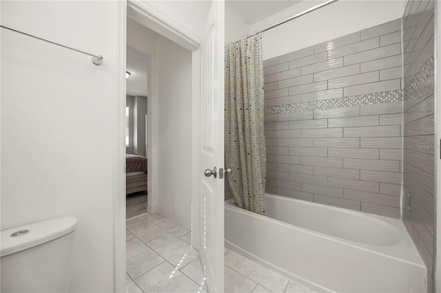 9567 Meadow Hunt Way, Winter Garden, FL 34787 - full bath with tile patterned floors, shower / bath combo, toilet, and ensuite bath