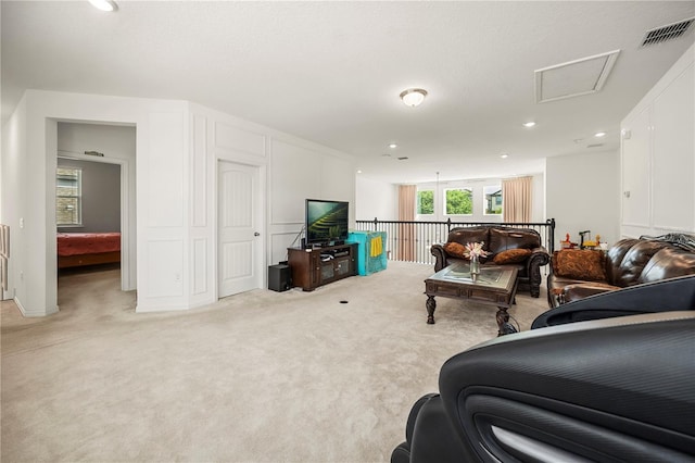 9567 Meadow Hunt Way, Winter Garden, FL 34787 - living room featuring attic access, light colored carpet, visible vents, and recessed lighting