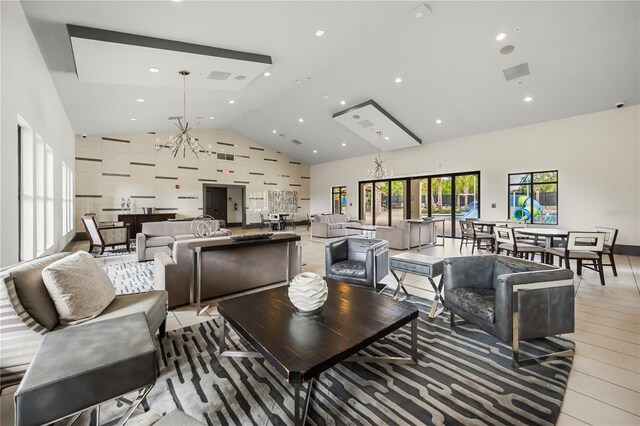 9567 Meadow Hunt Way, Winter Garden, FL 34787 - living area with visible vents, recessed lighting, a chandelier, and high vaulted ceiling
