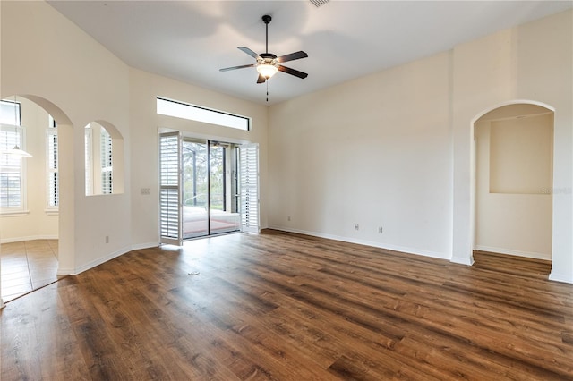 27127 Stoney Brook Dr, Leesburg, FL 34748 - spare room with plenty of natural light, ceiling fan, wood finished floors, and baseboards