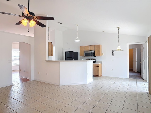 kitchen featuring high vaulted ceiling, arched walkways, stainless steel microwave, a ceiling fan, and black fridge