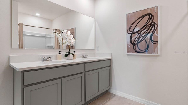 4582 Boxwood Way, Mount Dora, FL 32757 - bathroom with tile patterned flooring, a sink, baseboards, and double vanity