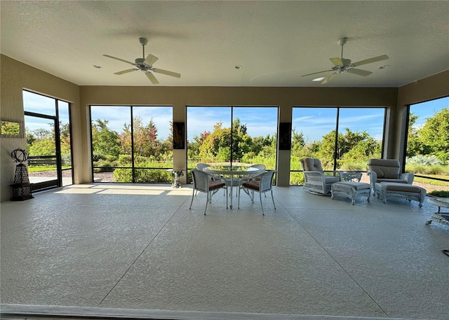 871 Iron Oak Way, The Villages, FL 32163 - sunroom featuring speckled floor, a textured ceiling, and a wealth of natural light
