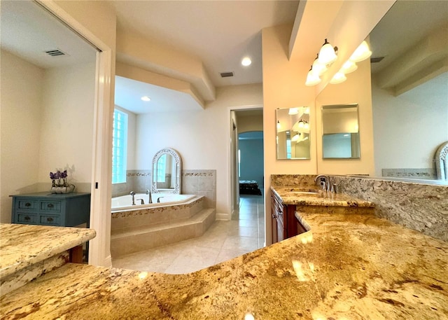 871 Iron Oak Way, The Villages, FL 32163 - full bathroom featuring visible vents, a garden tub, tile patterned floors, and vanity