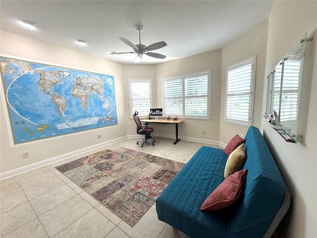 871 Iron Oak Way, The Villages, FL 32163 - tiled office with baseboards, a ceiling fan, and a textured ceiling