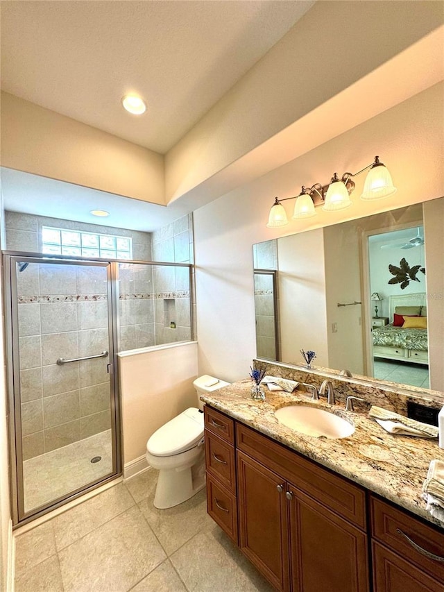 871 Iron Oak Way, The Villages, FL 32163 - ensuite bathroom with tile patterned flooring, vanity, toilet, ensuite bathroom, and a stall shower