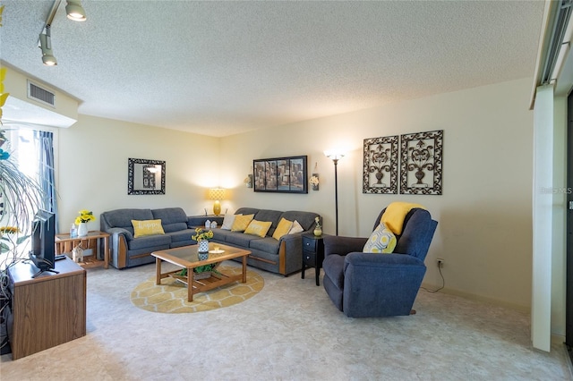 9 Buck Cir Unit 9, Haines City, FL 33844 - carpeted living area with a textured ceiling and visible vents