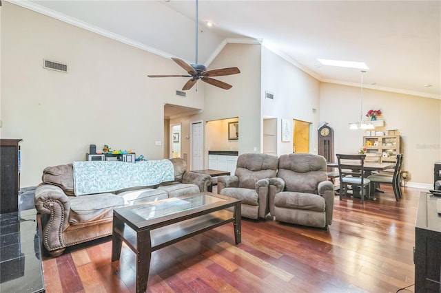 living room featuring visible vents, ceiling fan, wood finished floors, and high vaulted ceiling