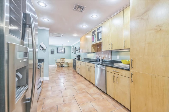 kitchen featuring recessed lighting, dark countertops, appliances with stainless steel finishes, and visible vents