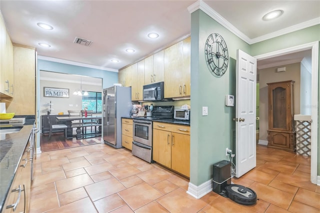 kitchen featuring recessed lighting, appliances with stainless steel finishes, ornamental molding, and visible vents