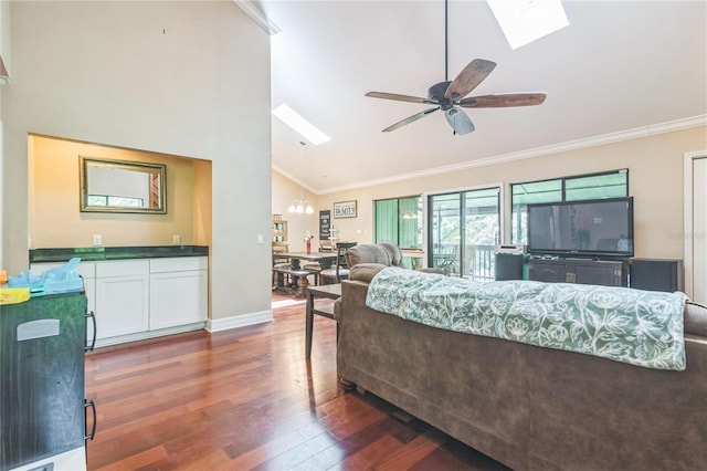 living room with ceiling fan, a skylight, wood finished floors, high vaulted ceiling, and ornamental molding