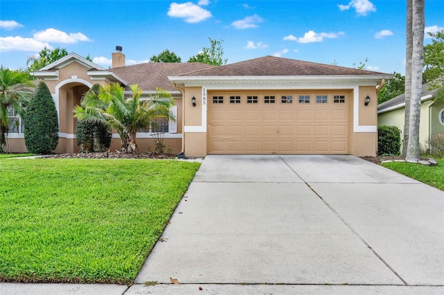 single story home featuring stucco siding, driveway, a front yard, a chimney, and an attached garage