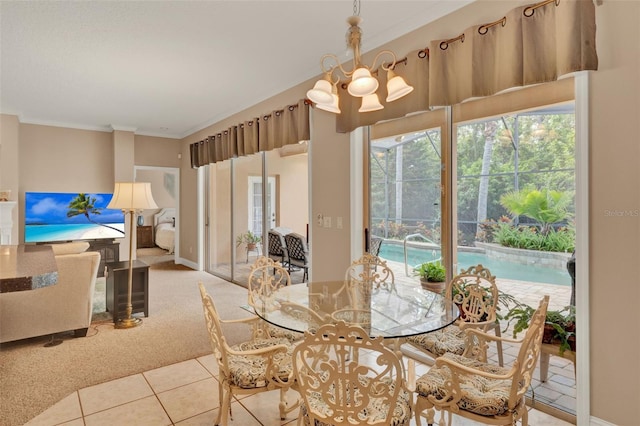 tiled dining room featuring carpet floors, a chandelier, and ornamental molding