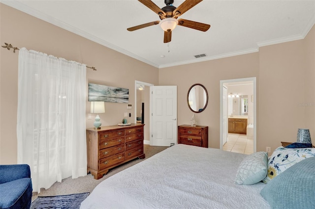 carpeted bedroom with crown molding, ensuite bath, and ceiling fan