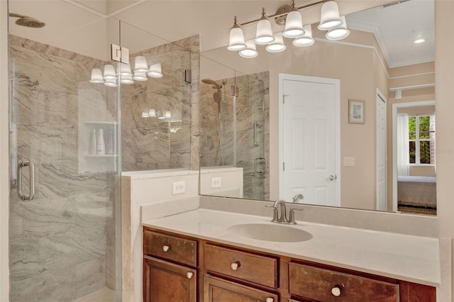 full bathroom with a stall shower, crown molding, and vanity