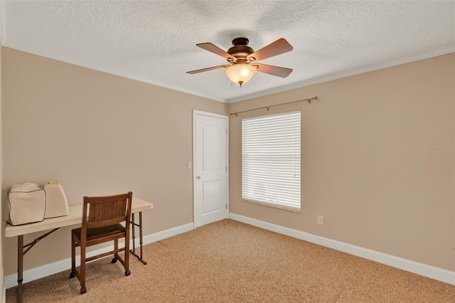 office featuring light colored carpet, a textured ceiling, a ceiling fan, baseboards, and ornamental molding